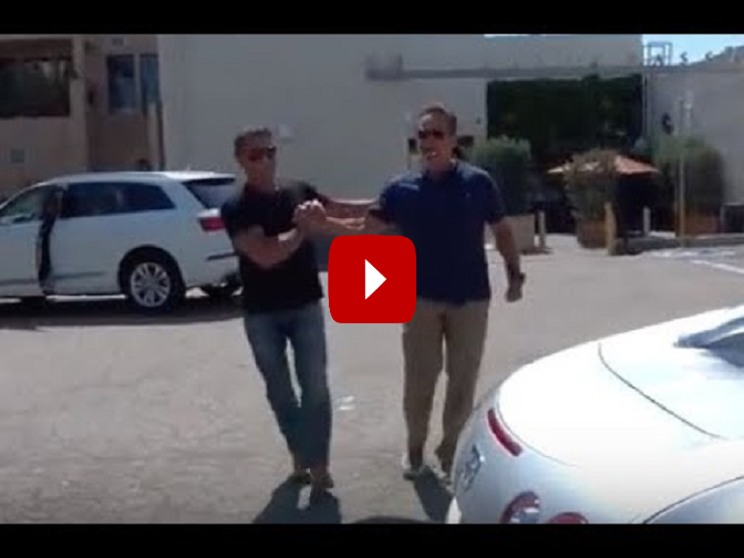 Arnold Schwarzenegger shows off his million dollar car to Sylvester Stallone