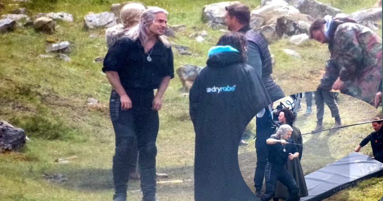 Henry Cavill wears a black tunic and knee-high boots as he films fight scenes for Netflix fantasy in Wales