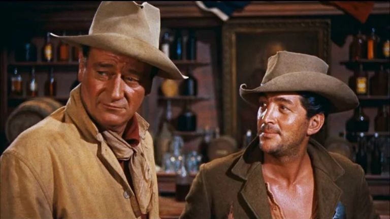 John Wayne1 day ago
																															
															Rio Bravo’s Success Pushed John Wayne And Howard Hawks To Plagiarize Themselves
															No filmmaker loved ripping off their own work more than Howard Hawks. And if your oeuvre is riddled with all-timers like “Bringing Up Baby,” “Only Angels…