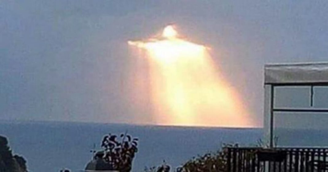 Man captures “Christ the Redeemer” glowing through the clouds - featured image