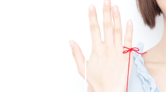 Red string tattoo on hand: Here’s what it means Red string tattoo on hand: Here’s what it means - featured image