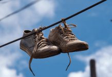 Many People Still Don’t Know The Meaning Behind Shoes Strung Up On A Power Line Many People Still Don’t Know The Meaning Behind Shoes Strung Up On A Power Line - featured image