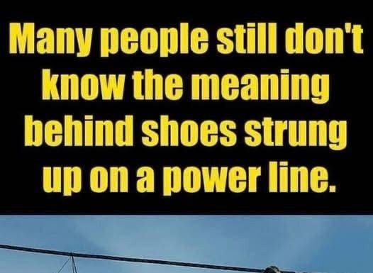 The Meaning Behind Shoes Strung Up On A Power Line The Meaning Behind Shoes Strung Up On A Power Line - featured image
