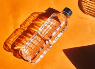 Why You Should Toss a Water Bottle Under Your Hotel Bed Why You Should Toss a Water Bottle Under Your Hotel Bed - featured image
