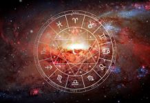 Daily Horoscope for September 2: You May Not See This Surprise Coming Glowing zodiac wheel with astrological symbols surrounded by fiery orange and red cosmic energy
