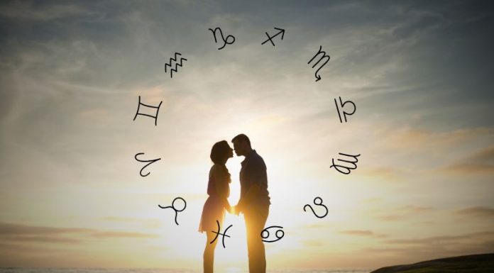 Daily Horoscope for September 9, 2026: This Will Be a Truly Magical Day Silhouetted couple standing together beneath floating zodiac symbols and soft golden light