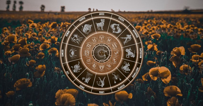 The Universe Is Restoring Balance — Karma Has a Message for These Signs Golden zodiac wheel with astrological symbols above a field of sunflowers under a warm evening sky