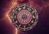 2026 Is Far From Over: Here’s What the Rest of the Year Has in Store for Your Zodiac Sign Glowing zodiac wheel with astrological symbols surrounded by purple lightning and cosmic energy