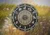 The Tension Is About to Explode — Someone Will Finally Reveal Who They Really Are Glowing zodiac wheel with astrological symbols above a dramatic landscape with warm golden light