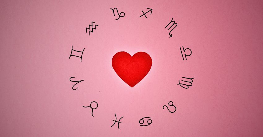 FORGET YOUR PLANS: The Rest of 2026 Has Something Unexpected in Store for Your Sign Red heart surrounded by zodiac symbols on a soft pink background