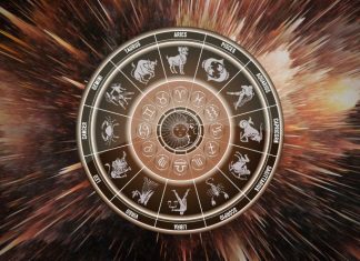 The One Guilty Pleasure Your Zodiac Sign Can’t Resist Glowing zodiac wheel with astrological symbols surrounded by warm brown and golden cosmic energy